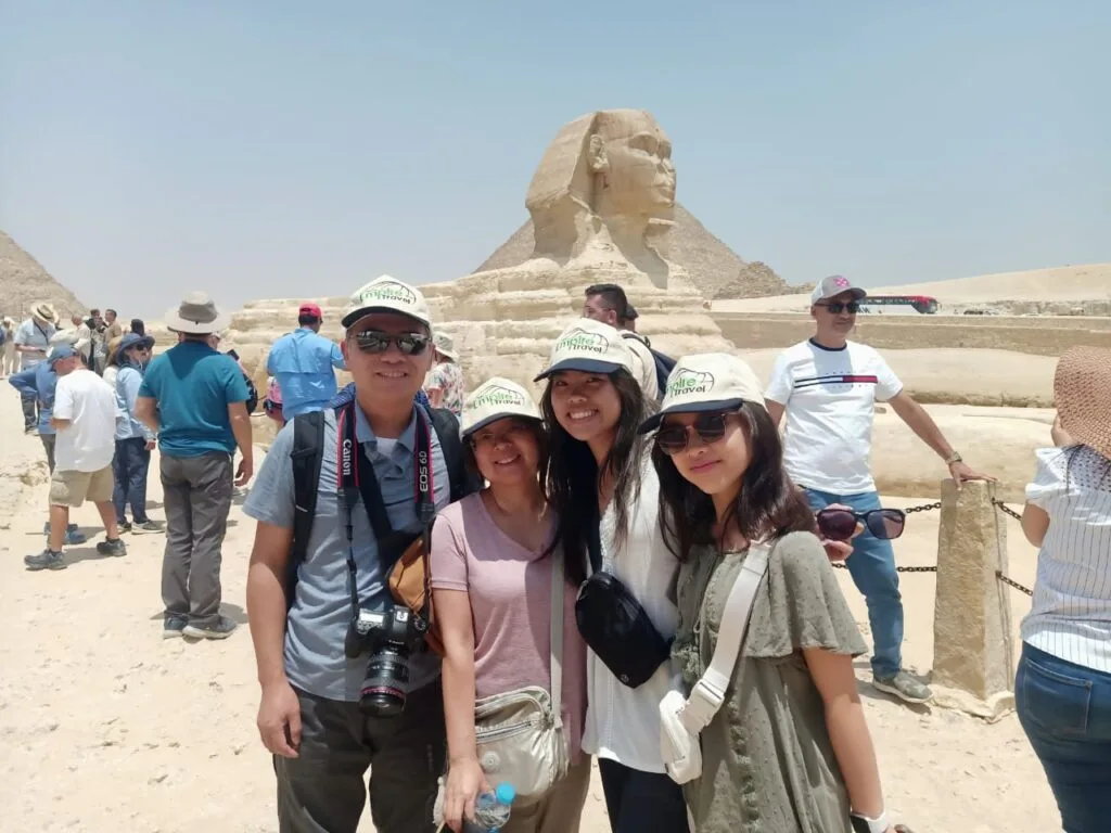 Tourists with Empire Travel hats visiting the Great Sphinx of Giza