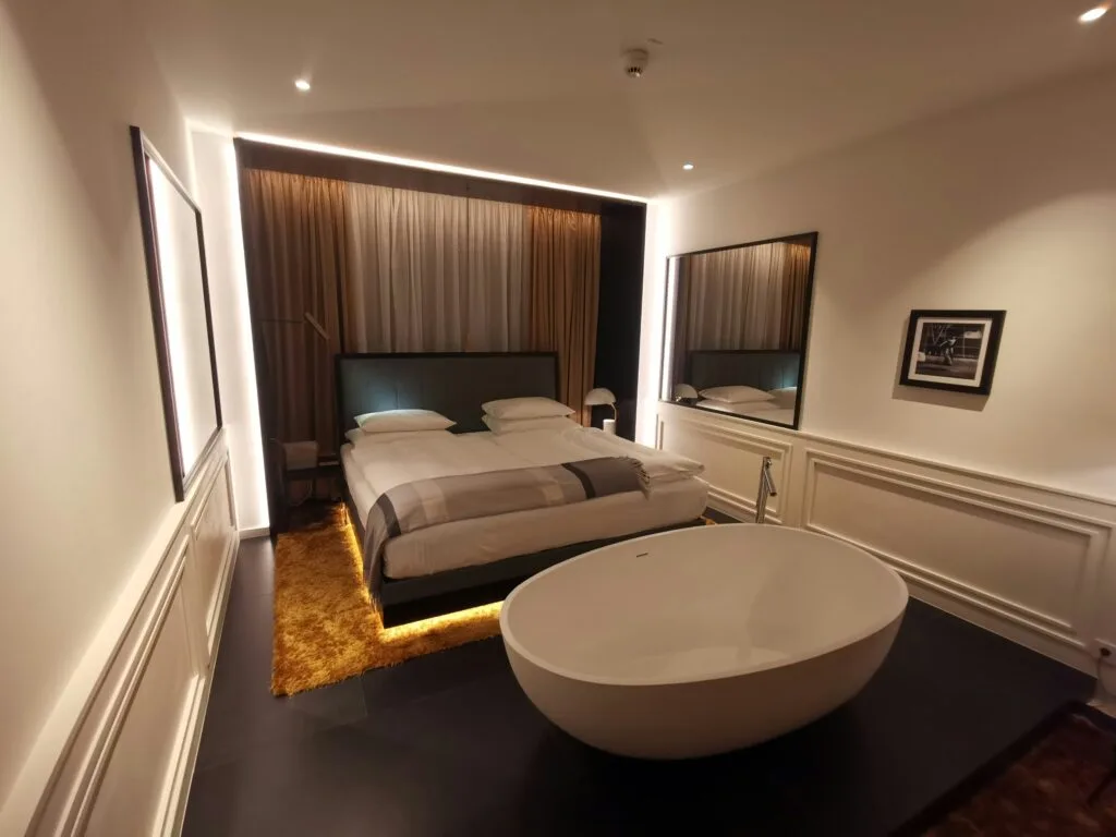 Luxury hotel room with modern design and freestanding bathtub