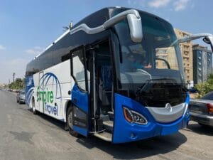 Empire Travel modern luxury tour bus with company branding for Egypt group tours and transportation Cairo
