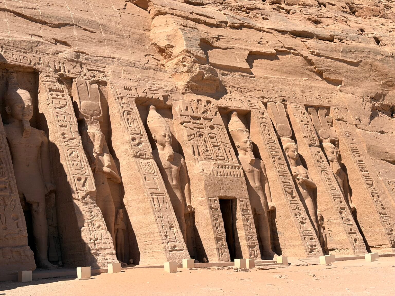 Facade of the Small Temple of Nefertari at Abu Simbel with statues carved into the rock