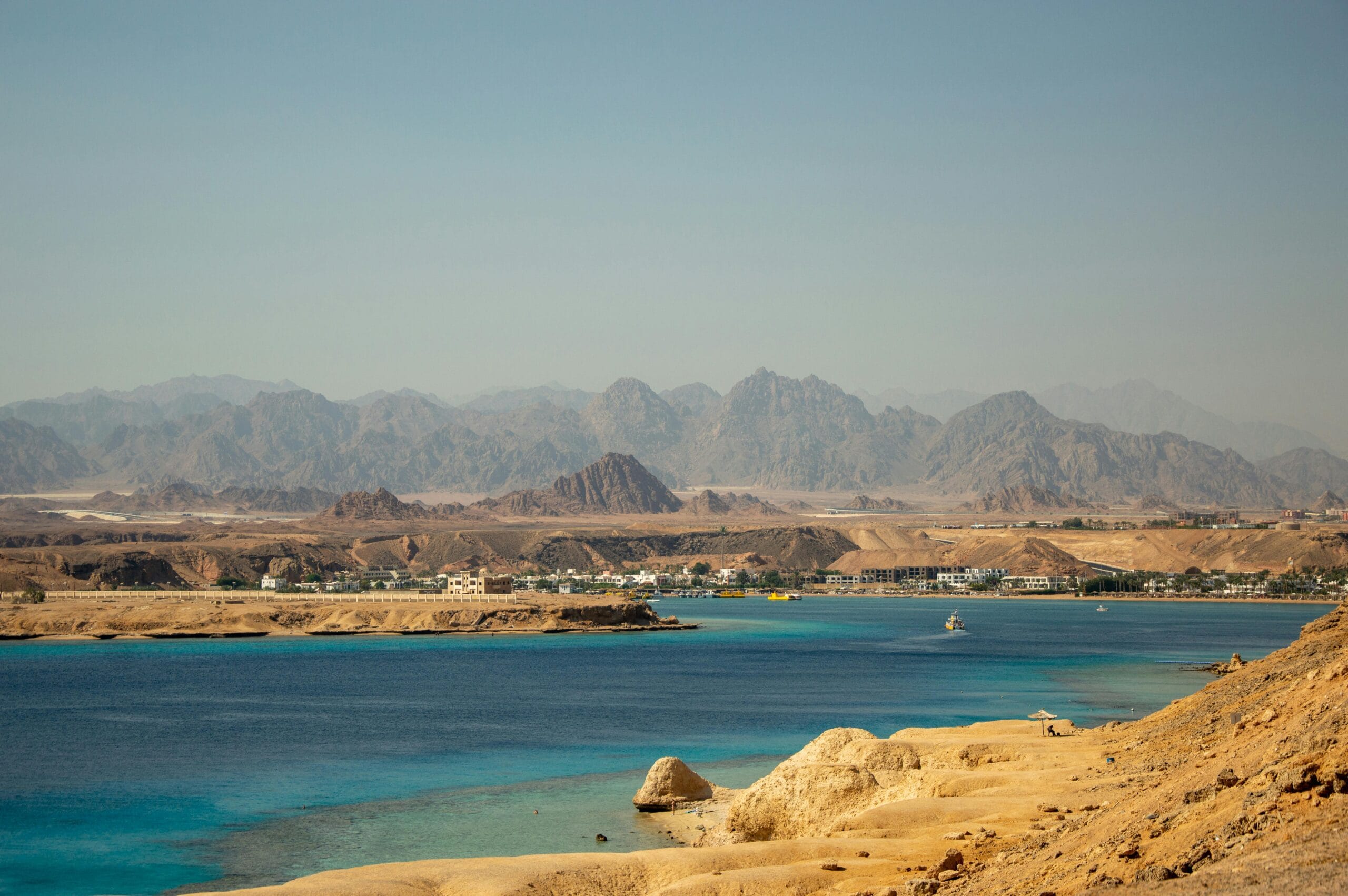 View of the Red Sea coastline and desert mountains near Sharm El Sheikh, Egypt.