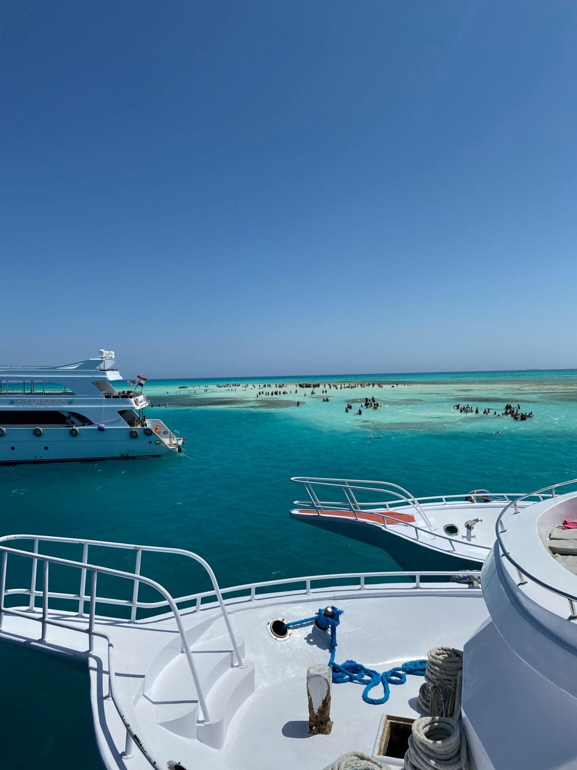 View from a yacht deck sailing on the turquoise waters of the Red Sea near Hurghada, Egypt.